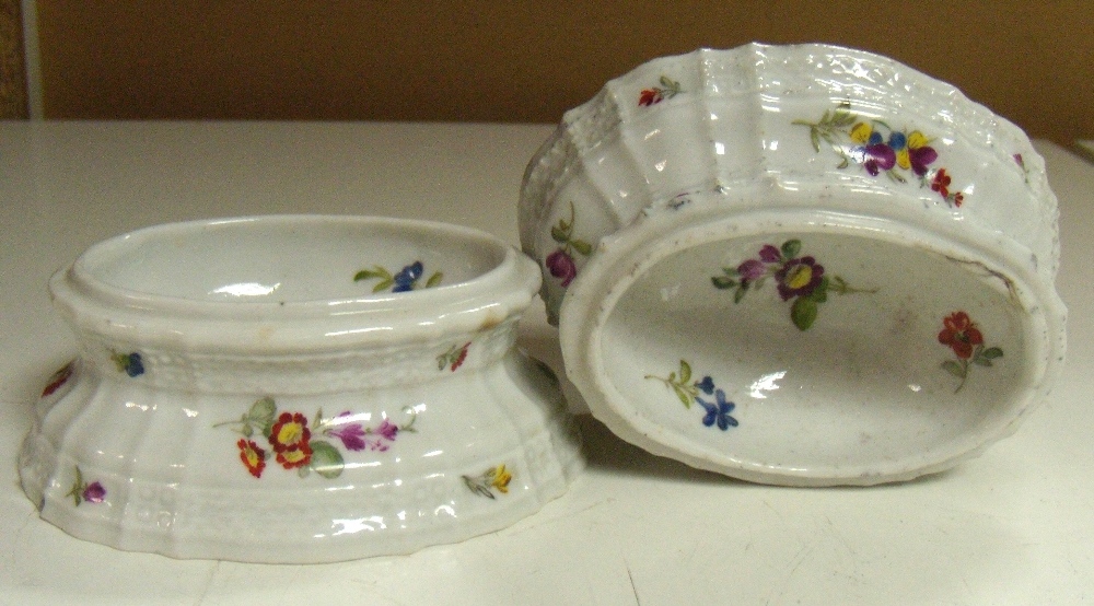 A pair of 19th century Volkstedt trencher salts painted with roses and other scattered flowers, the