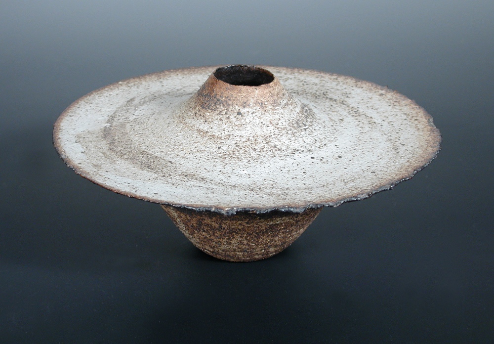 § Joanna Constantinidis, a stoneware Vase, of squat form, dry textured body and rust highlights,