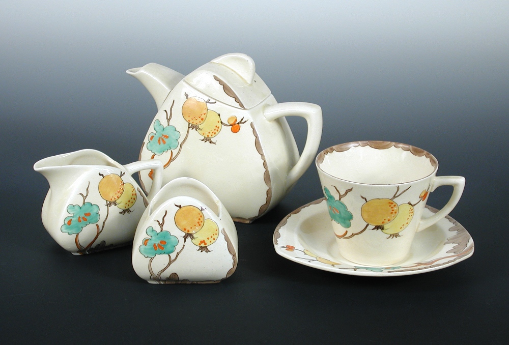 Passion Fruit, a Clarice Cliff breakfast set, comprising teapot and cover, sugar bowl, creamer,