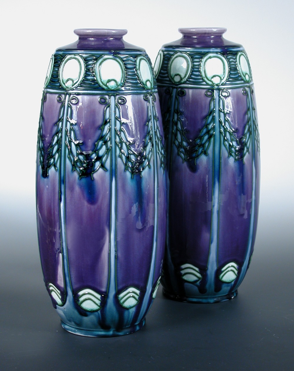 A pair of Minton Secessionist vases, probably designed by Leon Solon, decorated with a stylised