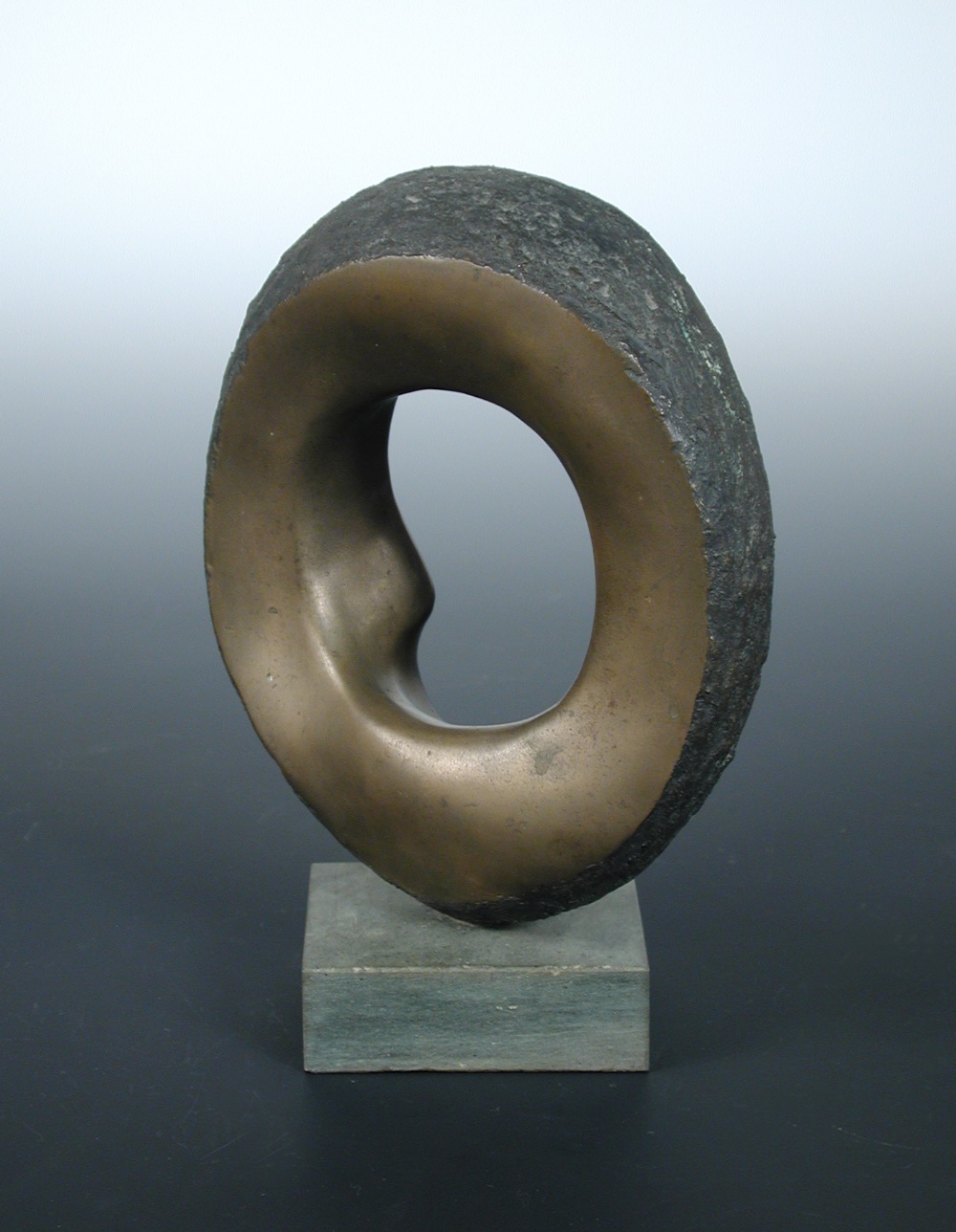Mike Gillespie, a small bronze, of circular form with textured outer, signed, number 1 of 6 and