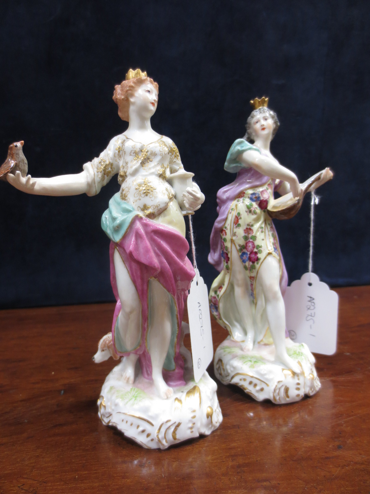 A pair of Samson `Derby` figures of maidens wearing crowns, one playing a lute, the other holding