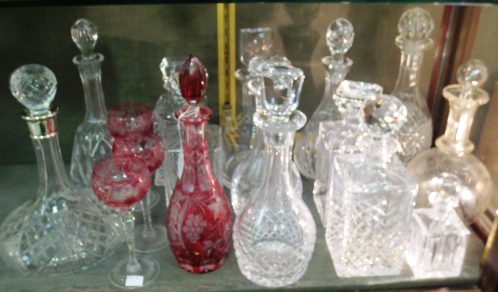 Thirteen various decanters with stoppers, a coloured decanter and 3 matching glasses