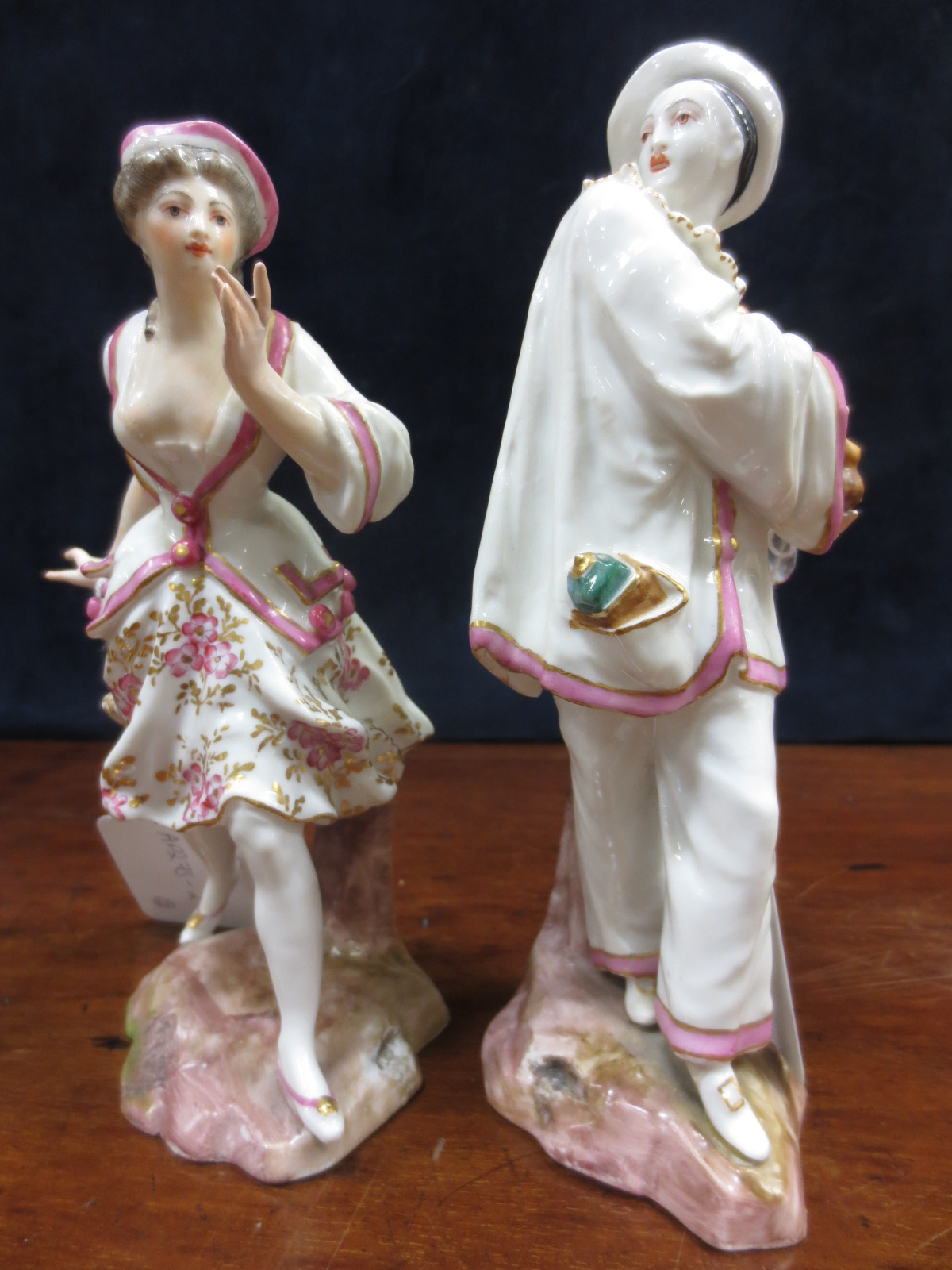 A pair of Samson `Gold Anchor` figures of a lady and a pierrot with gold anchor marks