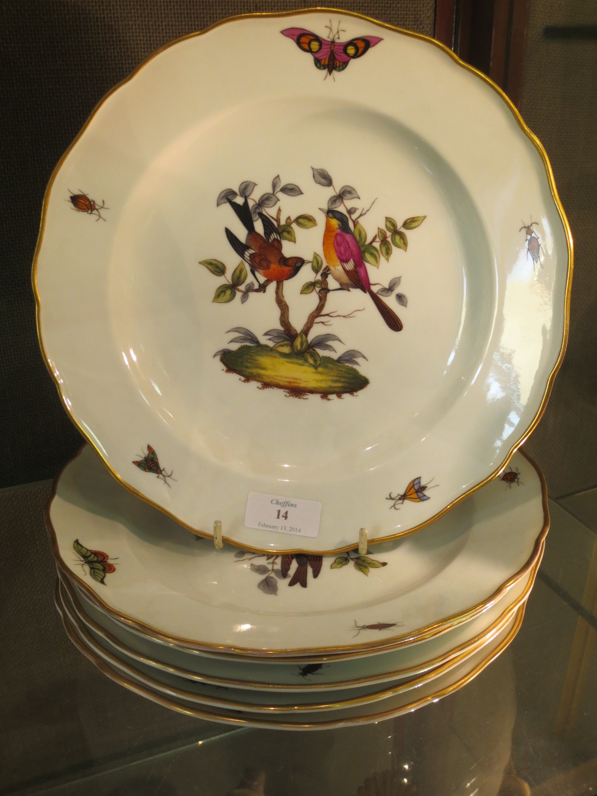 A set of six Minton hand painted plates, decorated with birds and butterflies