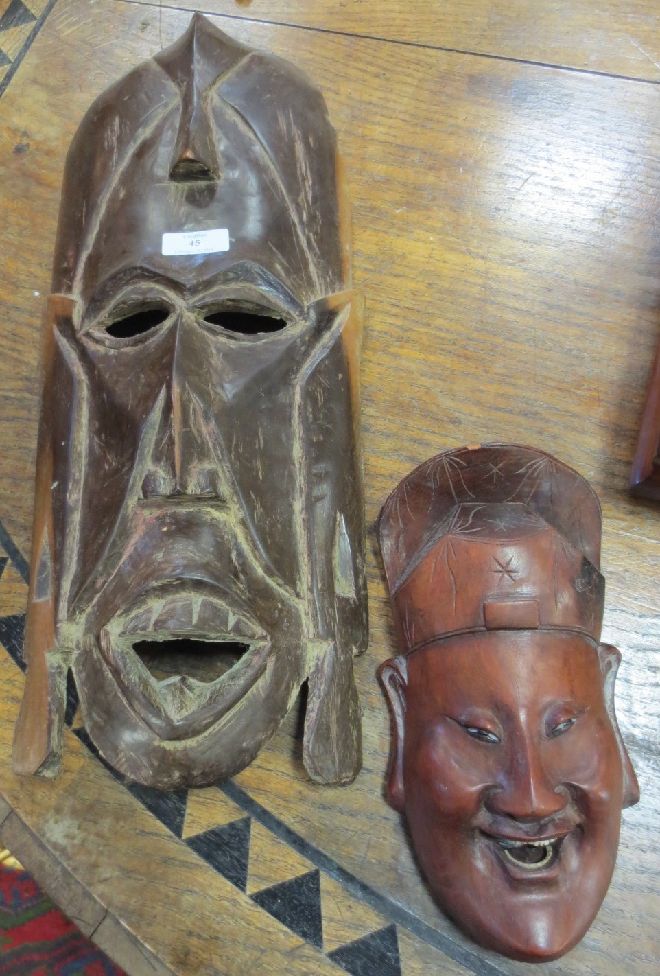 Two tribal carved wood masks