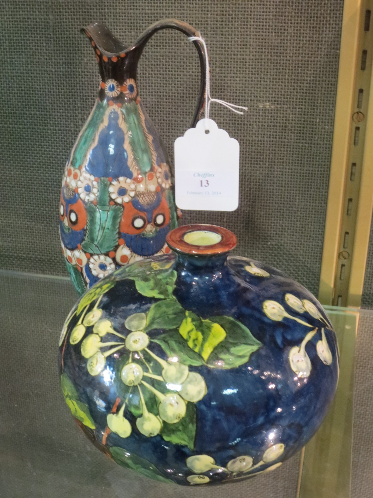 A Doulton faience blue ground vase and a Lake Thonne ewer