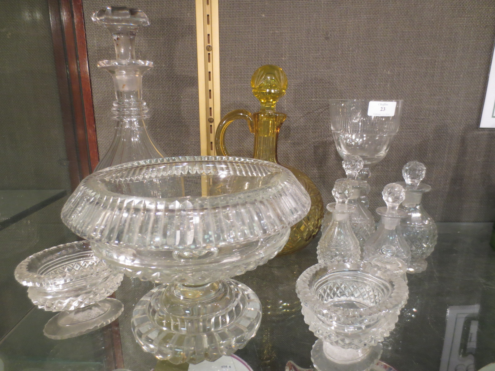 A 19th century cut glass rose bowl and a quantity of other cut glass and decanters