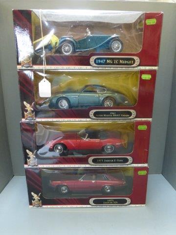 Four boxed Road Signature 1:18 scale Deluxe Edition diecast models: A 1947 MG TC Midget; a 1961