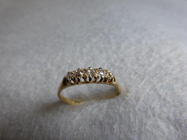 An 18ct gold five stone old cut diamond ring, 0.3 carat, ring size M.
