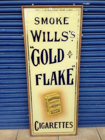 A good Wills`s `Gold Flake` pictorial glass advertising sign set within a wooden frame, 27 x 68".