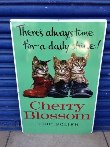 A Cherry Blossom Shoe Polish `Cats in boots` tin advertising sign, 17 3/4 x 26 3/4".