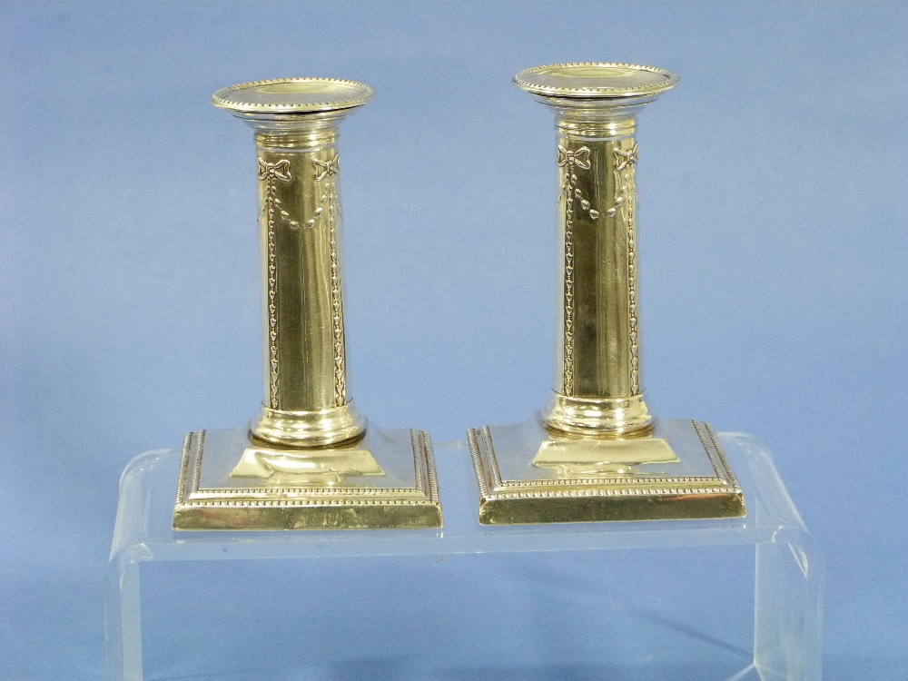 A pair of Victorian silver short Candlesticks, by Goldsmiths Company, hallmarked London, 1899, with