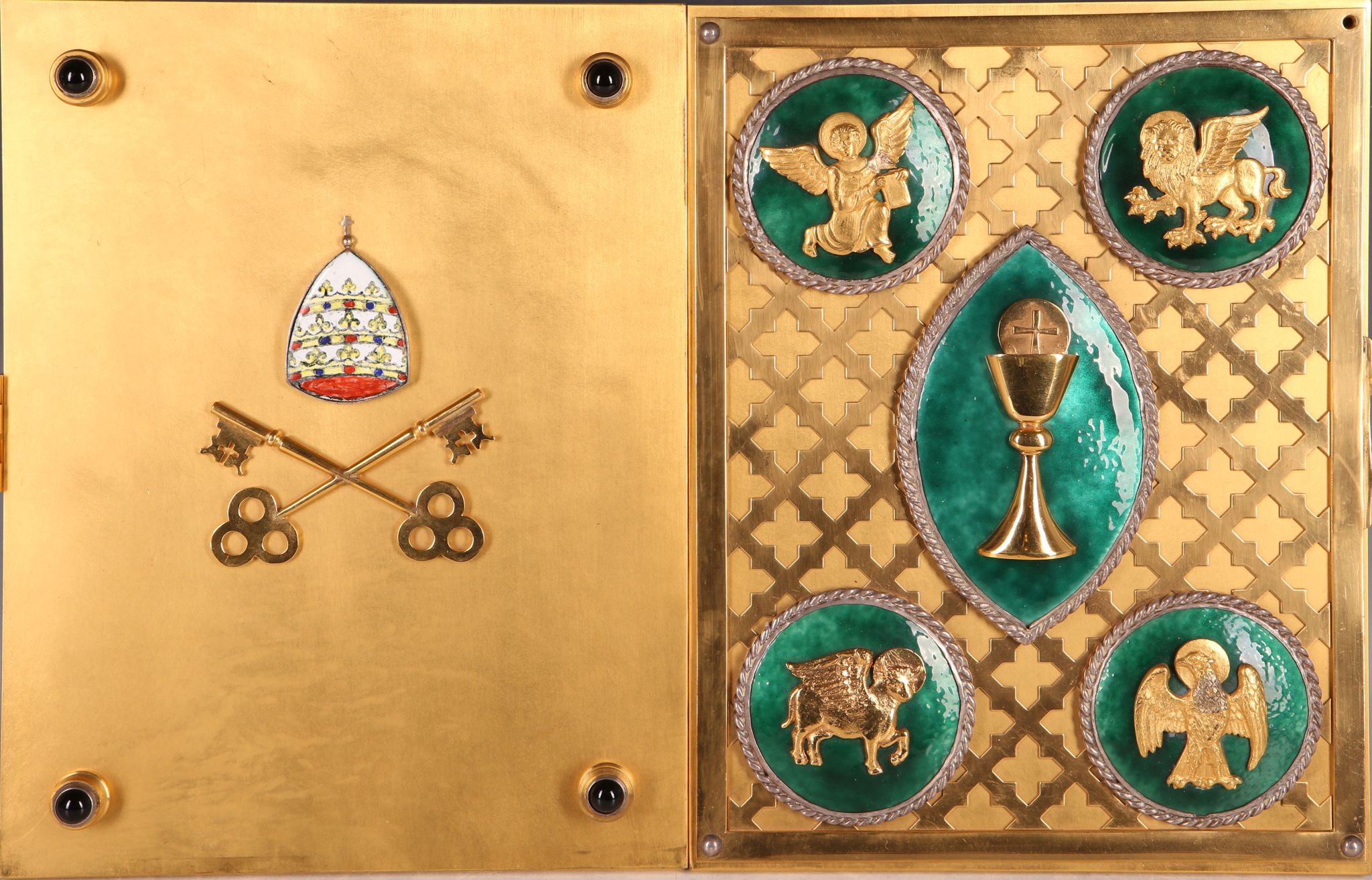 A gilded brass Missal cover, the lattice front with enamel roundels bearing signs of the four