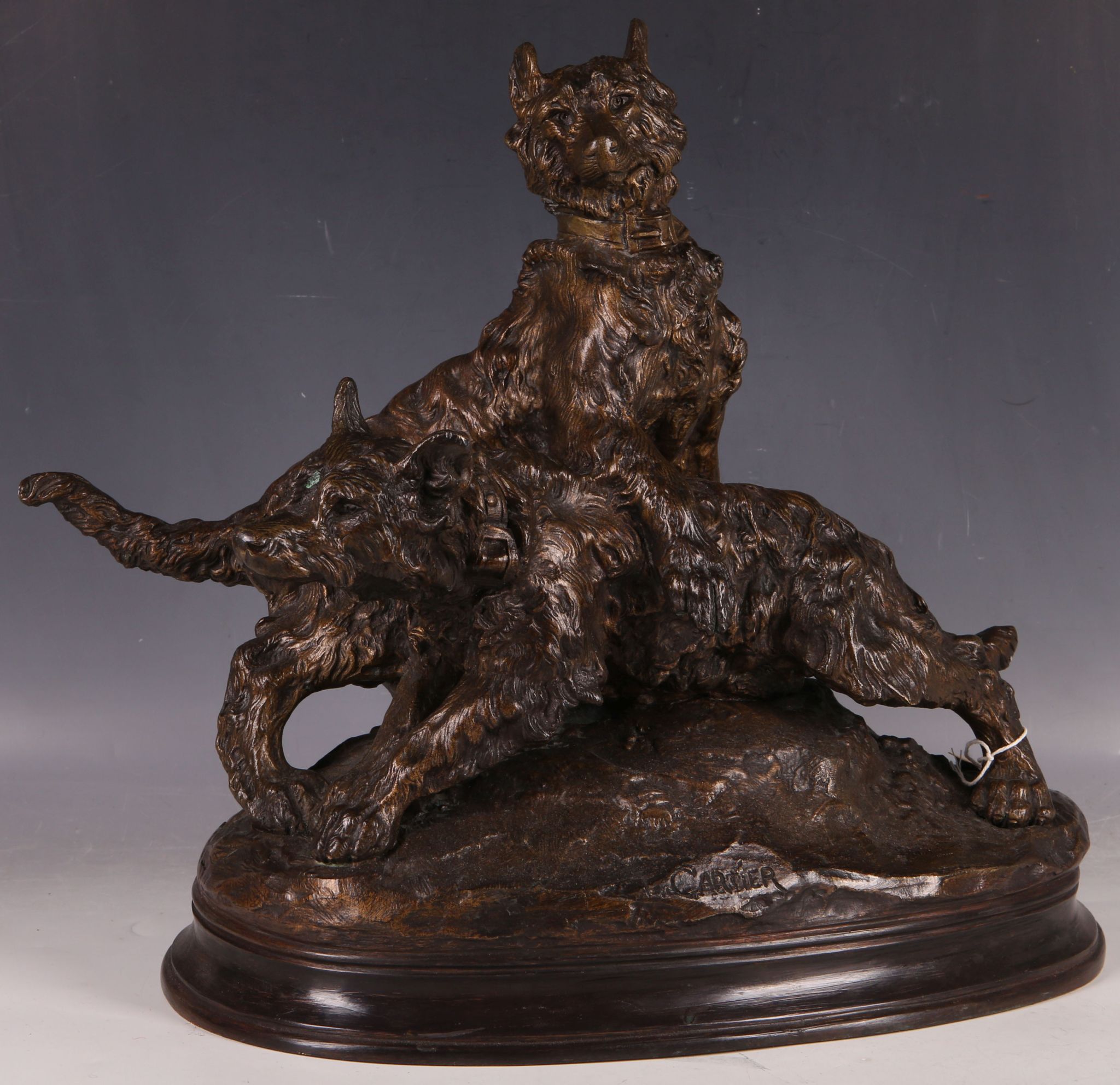 An Animalier bronze study of clogs on a naturalistic oval base, signed, 40cm H x 44mc W.