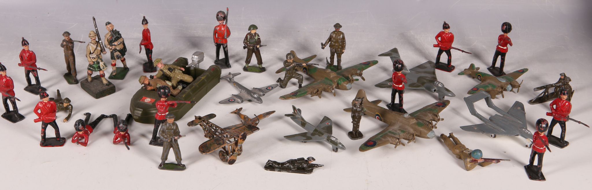 A WW2 lead and alloy aircraft and soldiers and Britain`s raiding craft.