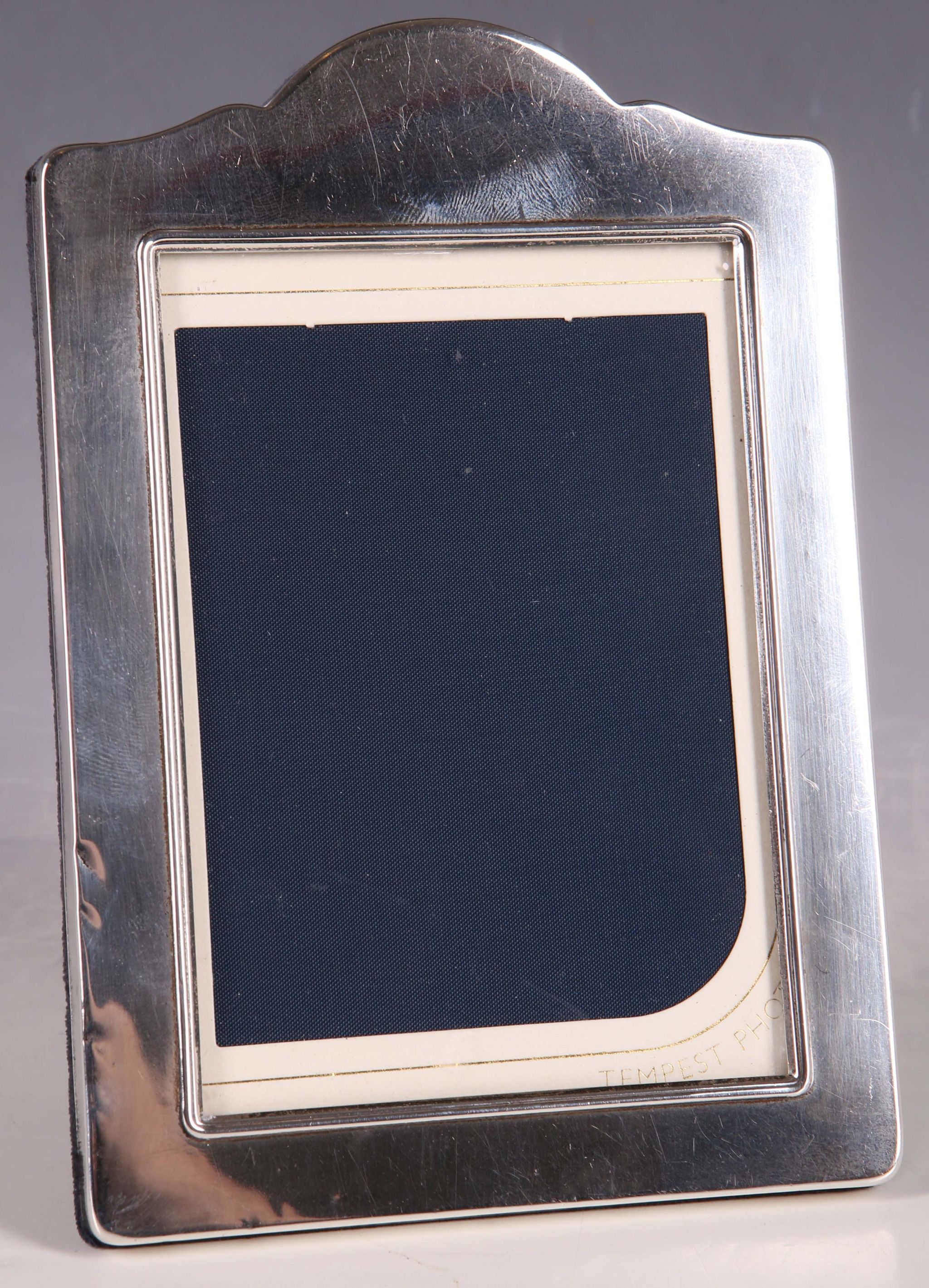 A hallmarked silver photograph frame of plain design, Sheffield 1991, 17cm high.
