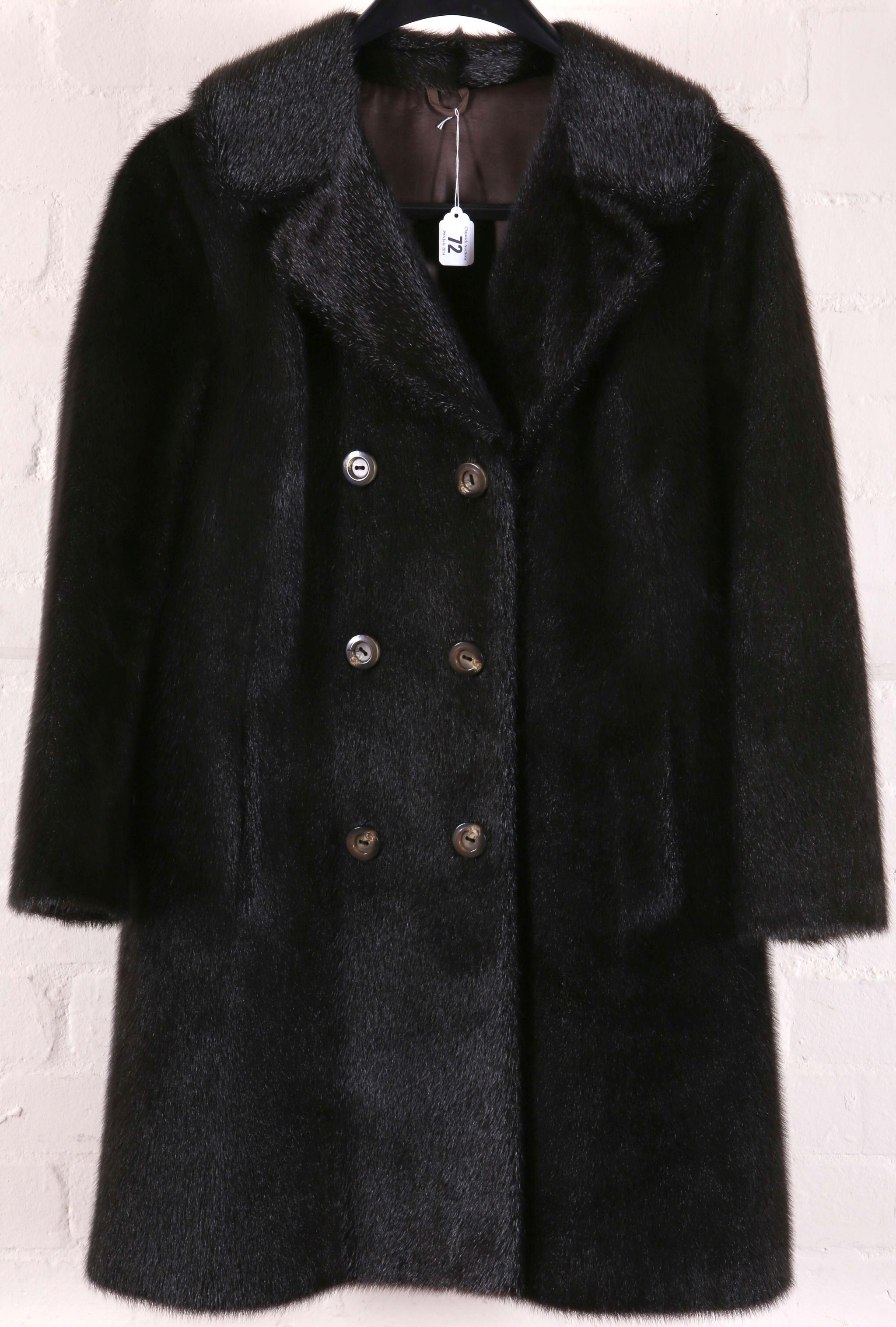 A vintage ladies black double breasted fur coat, with collar, eight buttons, side pockets, satin