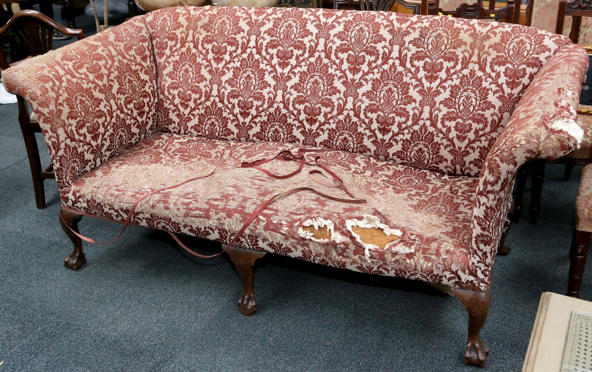 A 19th Century settee, with damask upholstery, horse hair filling and mahogany bar/claw feet.