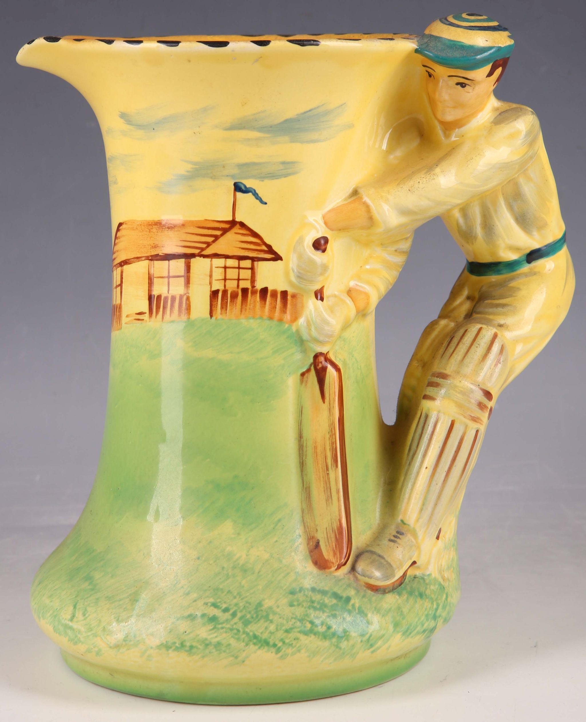 Burleigh ware cricket water jug, stitch pattern rim, batsman handle in front of the pavilion,