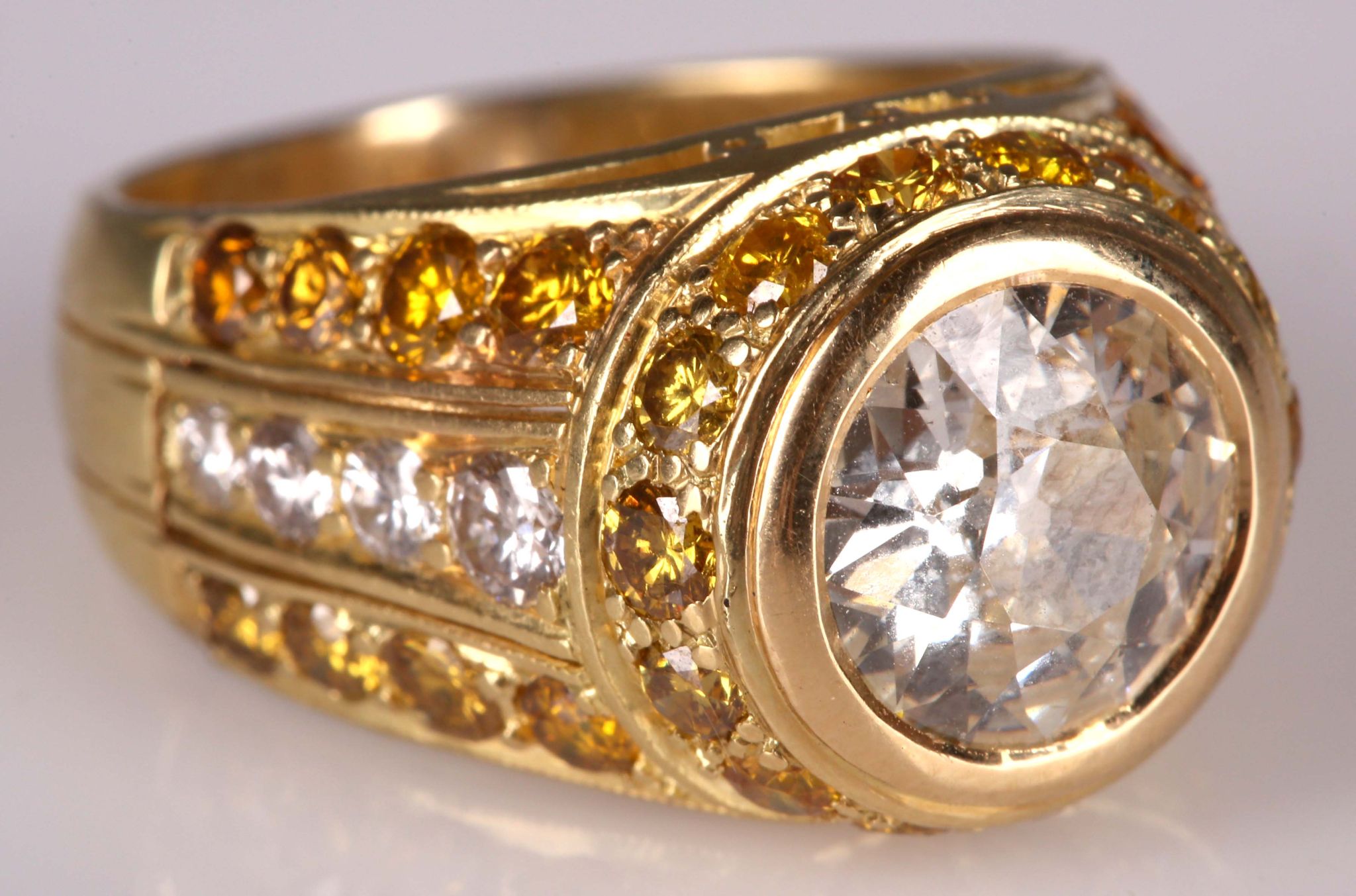 A fine 18ct gold and diamond ring, the 2.14ct centre brilliant round cut stone framed by yellow