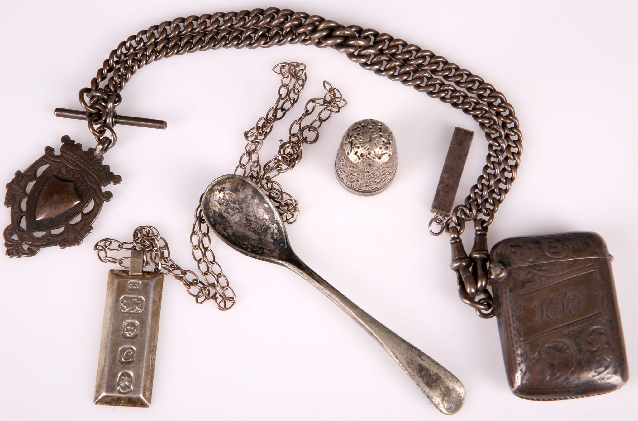 A small selection of hallmarked silver, to include a vesta on heavy curb fob chain, a thimble, two