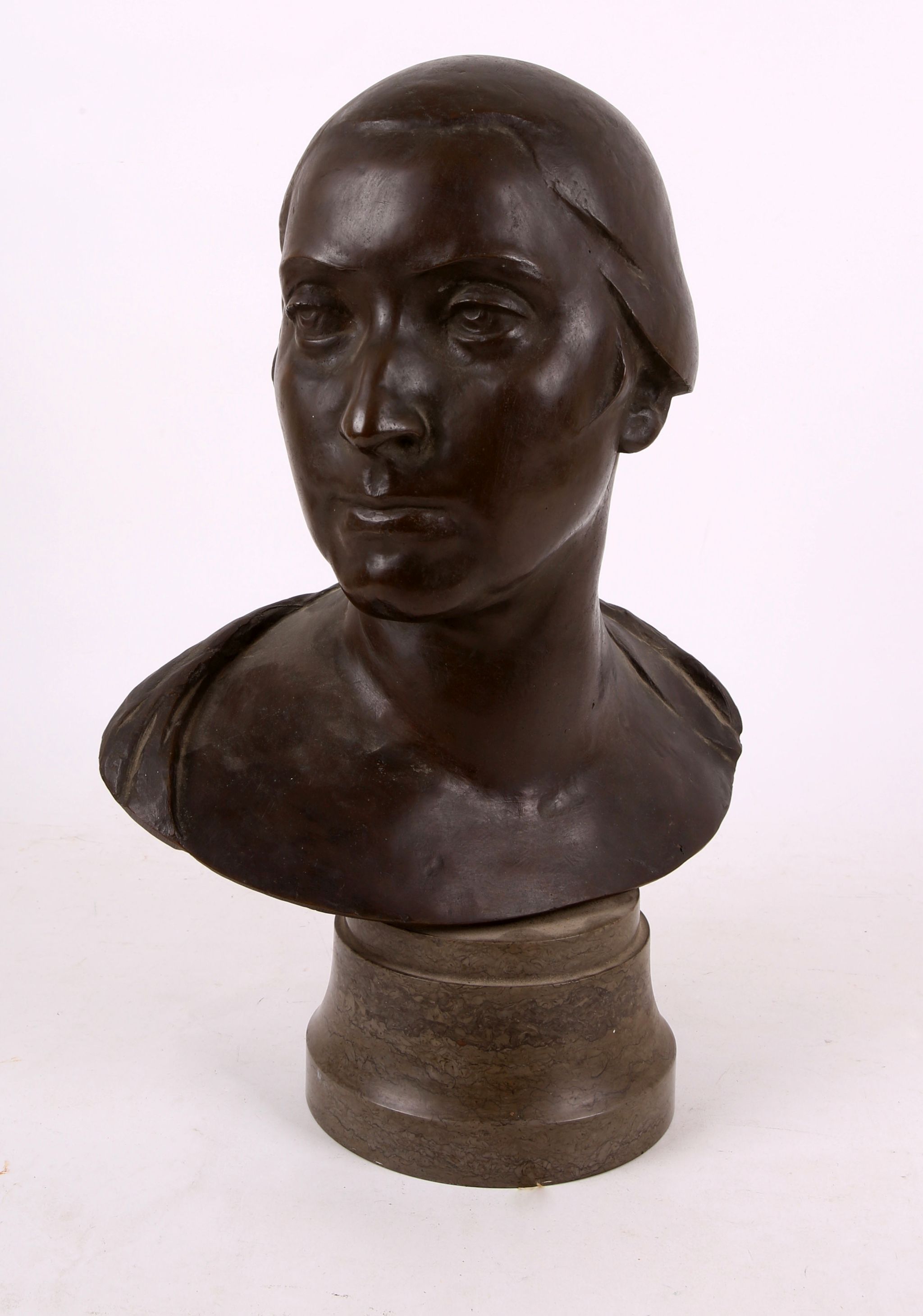 A bronze female bust, circa 1920s, on circular marble base (44cm), signed E. H.