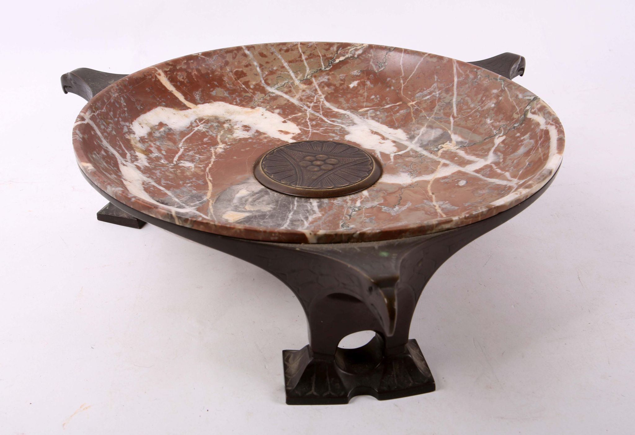 A rare 1920s German bronze mounted circular rouge marble bowl, centred with stylised flower bronze