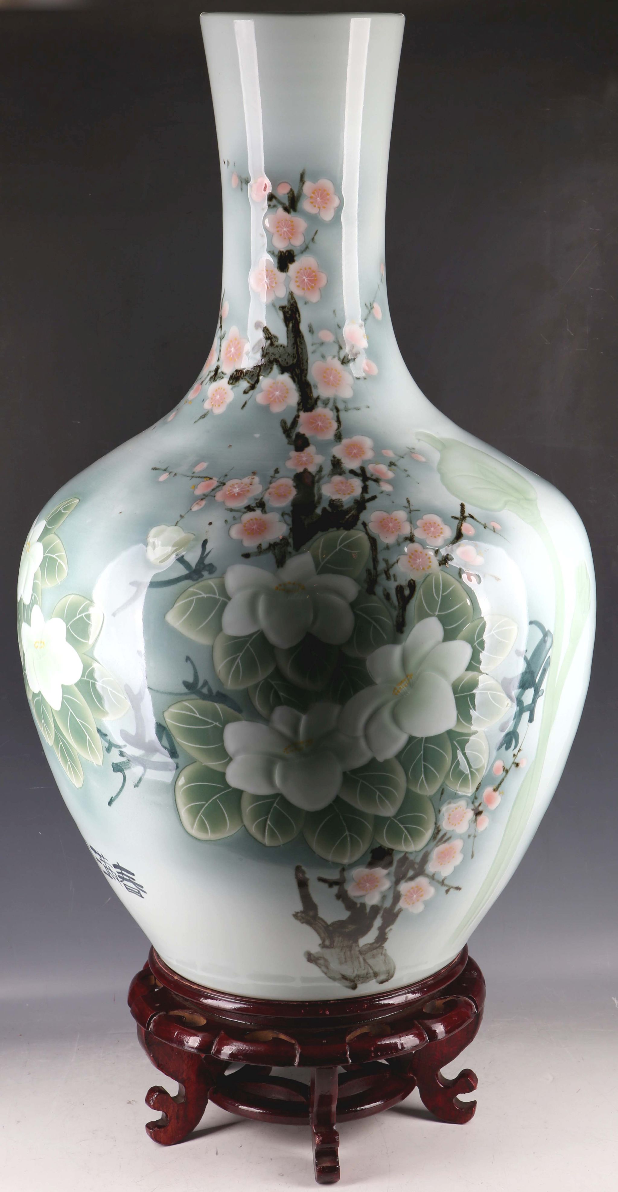 A large 20th Century Chinese export bottle shaped porcelain vase, applied with flowering branches on