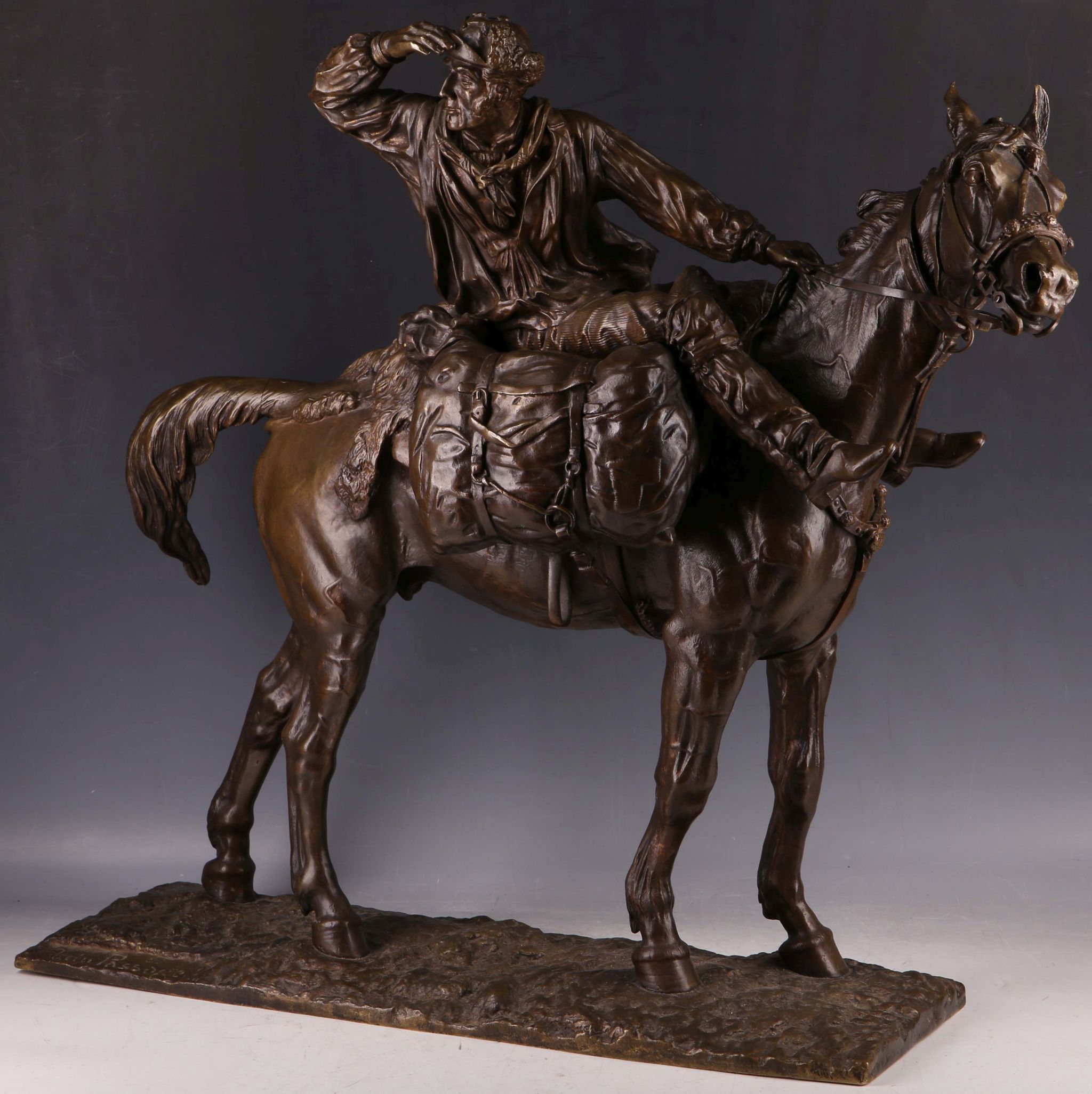 A handsome bronze figural group of a Cossack horseman after `Passage`, 55.8cm H.