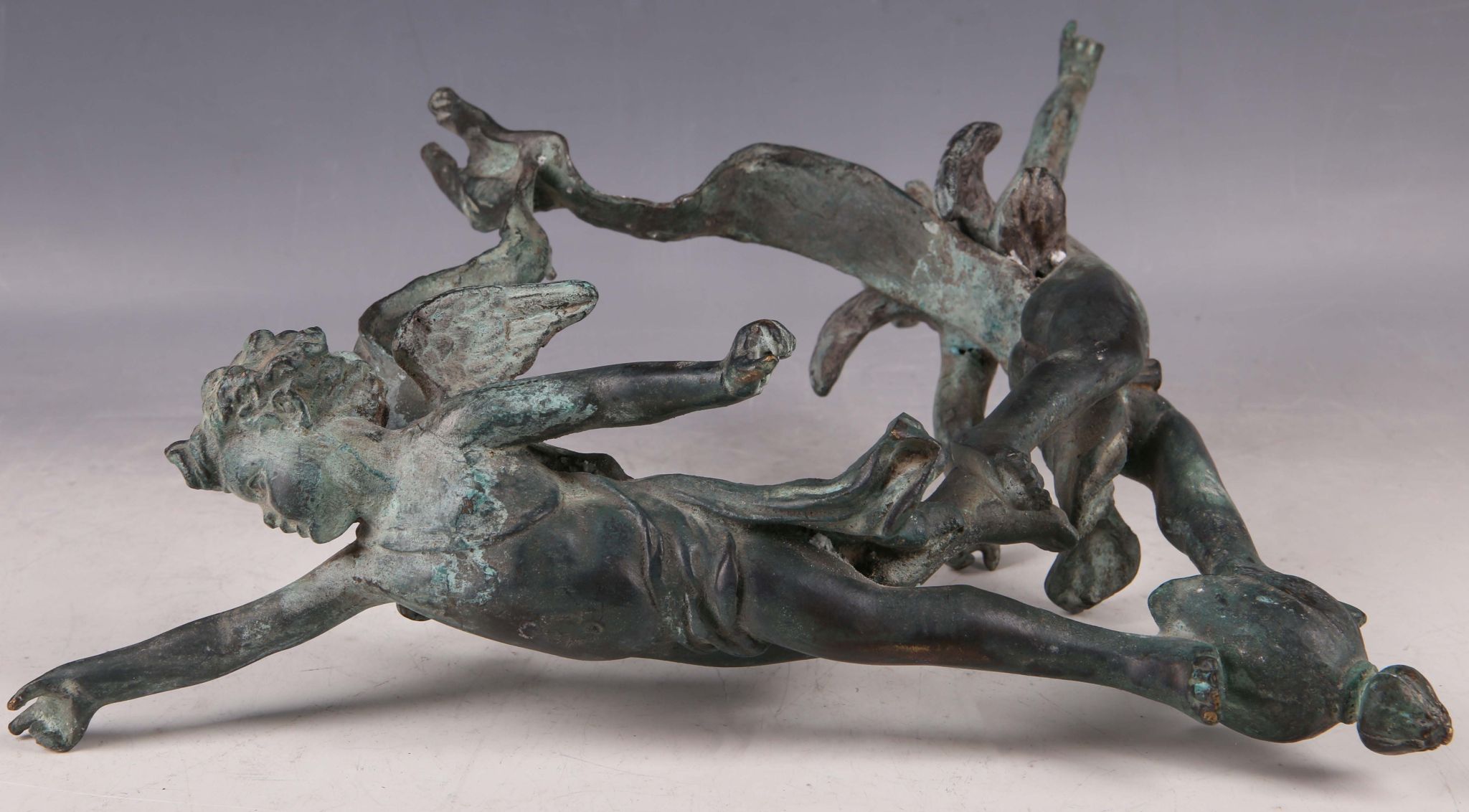 An Italian late 19th Century bronze ceiling decoration, study of two angels, joined by a `ribbon`