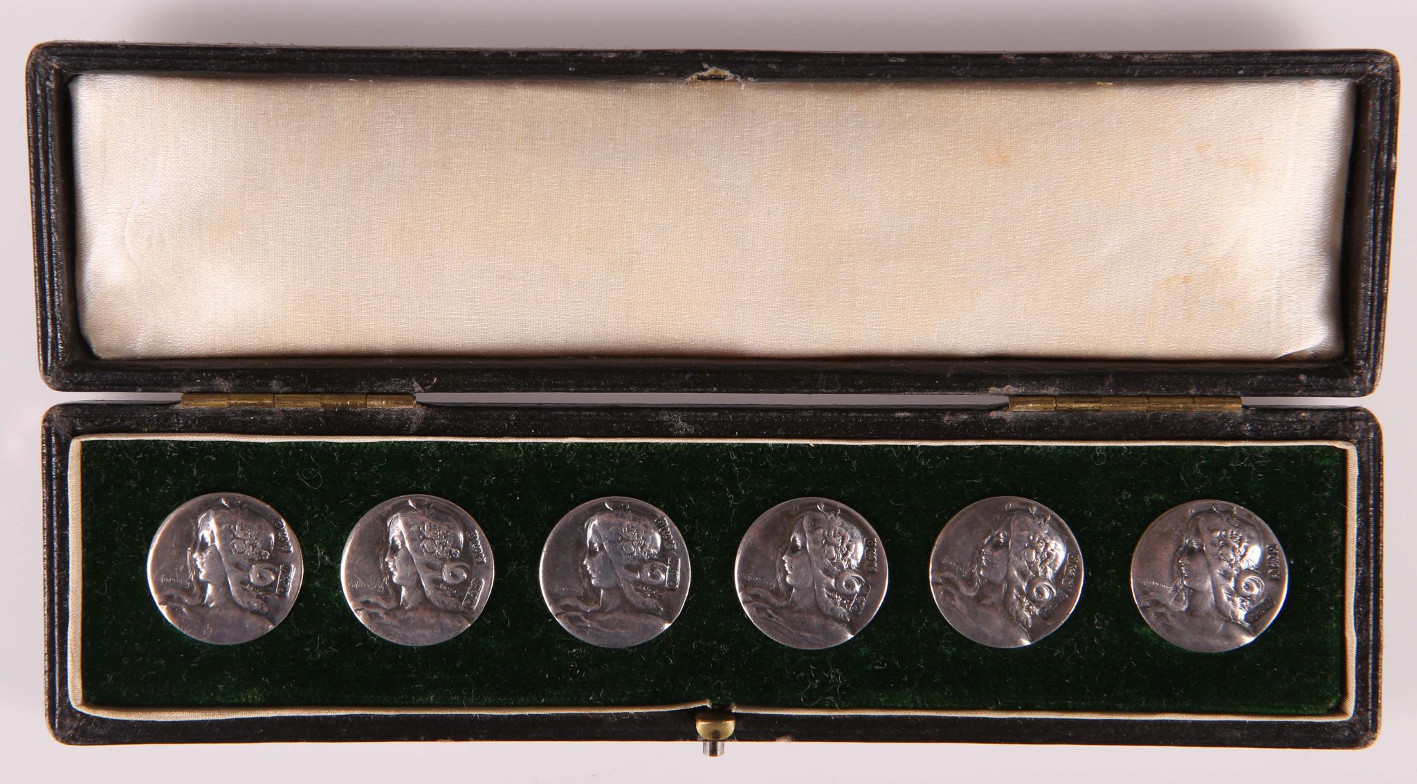 J. Rusmanny set of six silver Art Nouveau buttons, the bust of a young girl Birmingham 1902, cased.