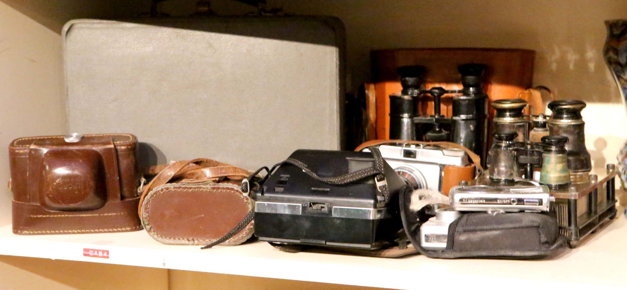 A Yashica Electro 35 camera, with original case and accessories, together with vintage field glasses