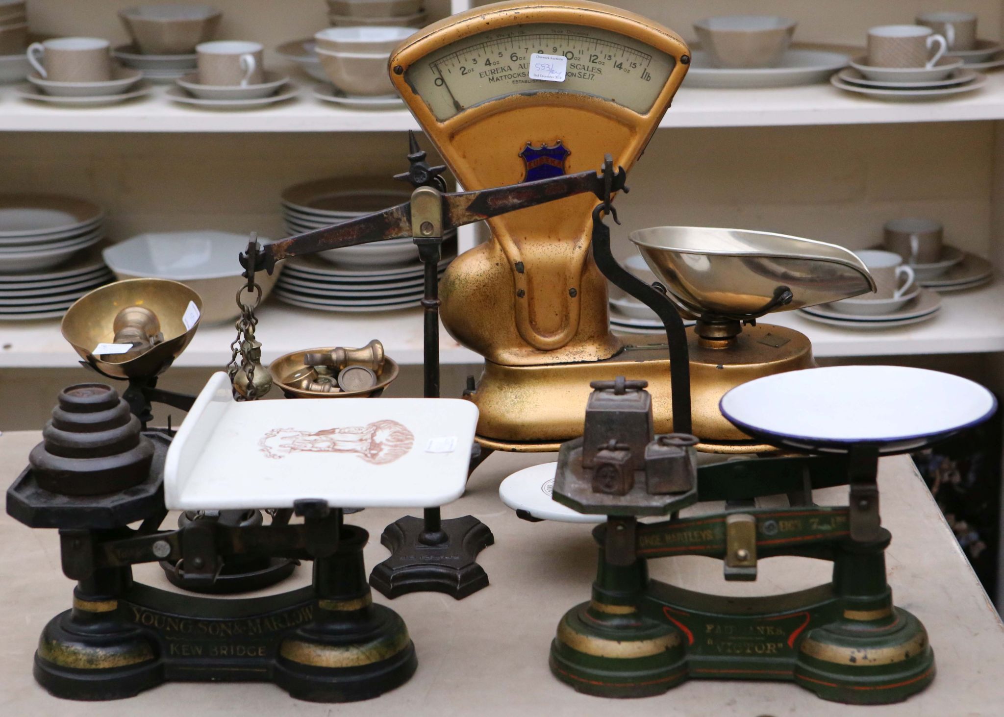 Five various vintage shop scales and sets of graduated weights, including Bell weights, Siddons cast