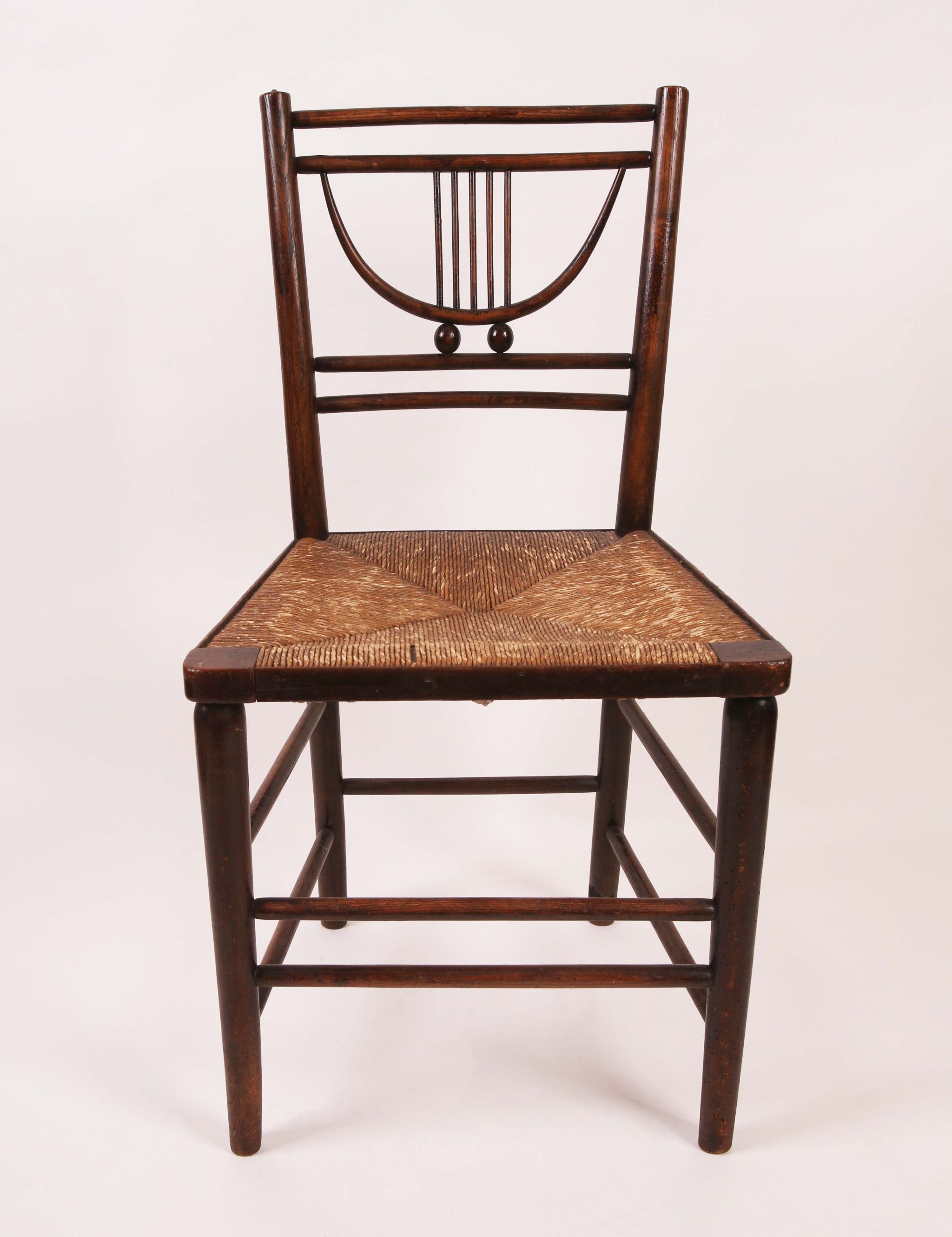 Attributed to William Morris, a late 19th century `Sussex` chair, with rush seat. - Image 2 of 5