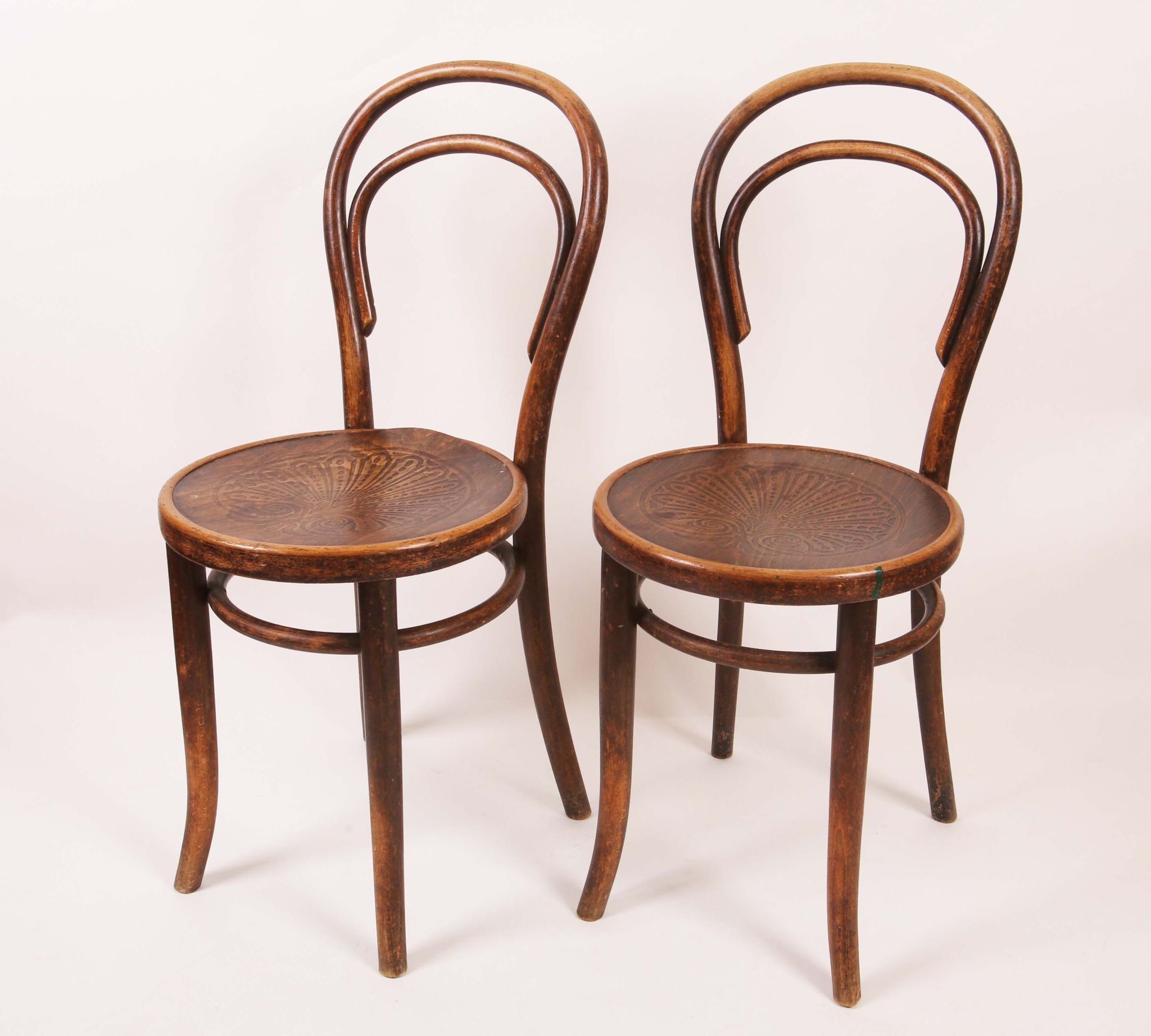 A set of six Thonet bentwood chairs, with paper labels under some chairs. (6)
