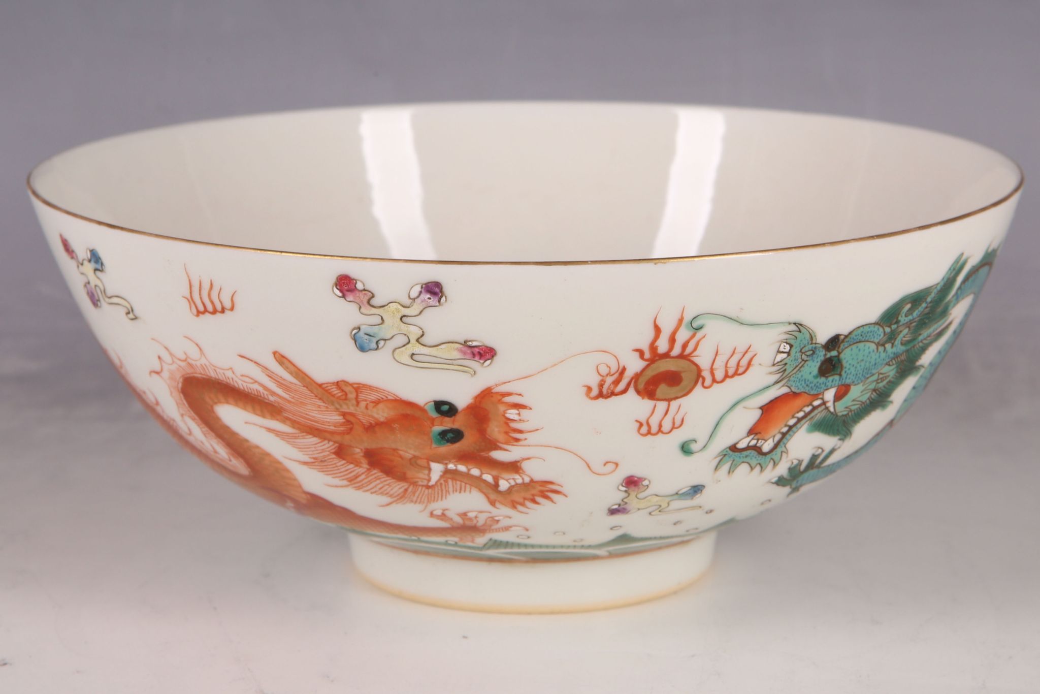 A Chinese bowl, Daoguang style mark to base, red symbol to inner surrounded by bats, with red and