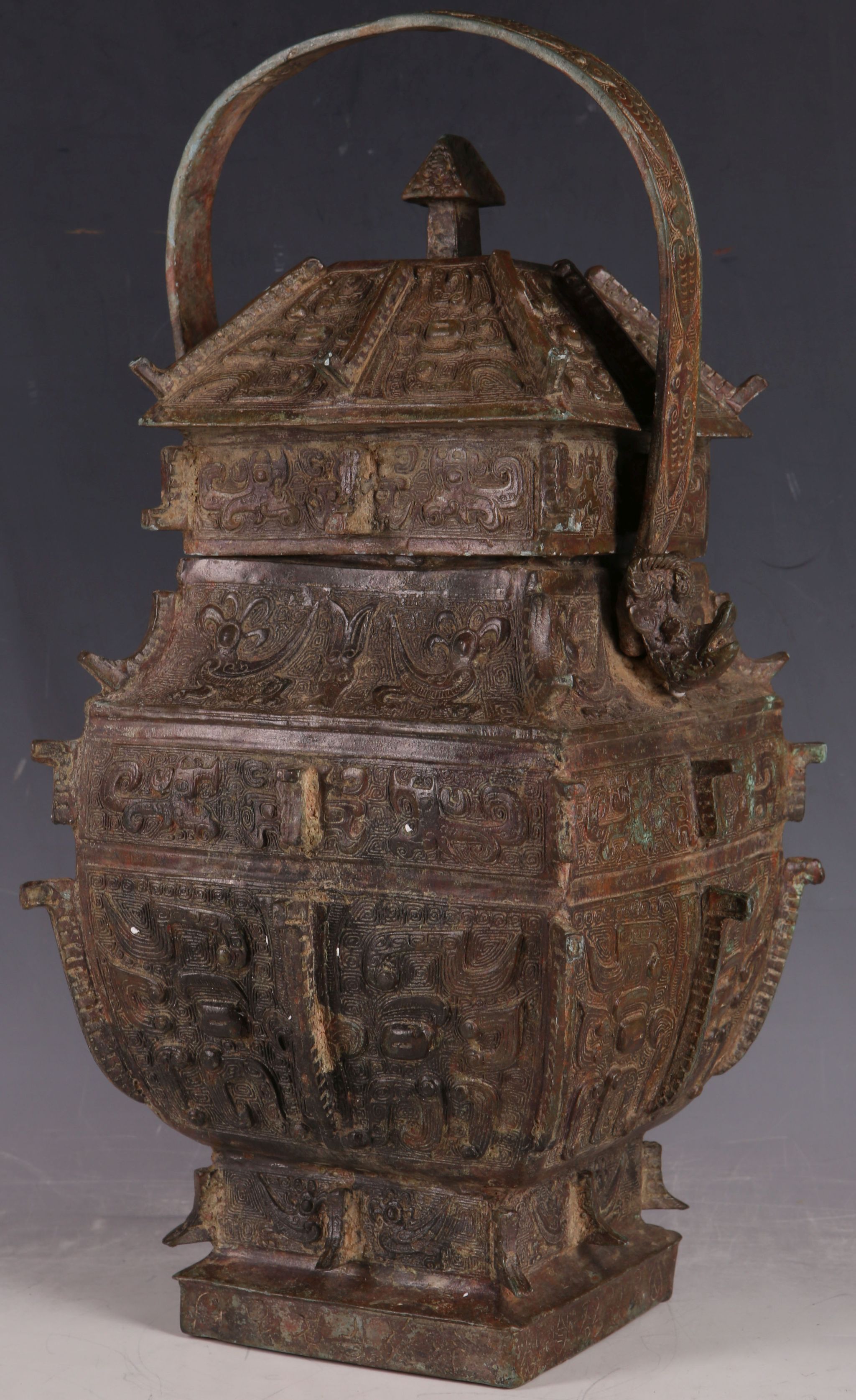 A Chinese archaic form Ming dynasty bronze casket wine vessel in the form of a house, multi panel - Image 2 of 2