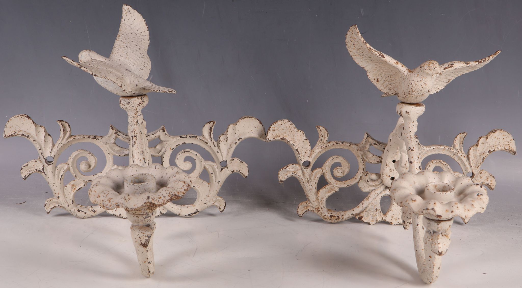 A pair of French garden candle sconces, dove finial, scroll branch arm, leaf drips, 23cm H.