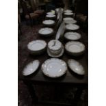 A Limoge porcelain part table service, to include dinner plates, side plates, soup dishes, a soup
