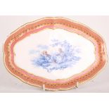 A 19th Century Sevrès porcelain cartouche shape dish, the pink and gilt border with view in blue