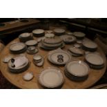 A Limoge porcelain part table service, to include dinner plates, side plates, soup dishes, a soup