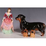 A large Royal Doulton porcelain model of Dachshund HN1124, sold together with two Royal Doulton