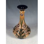 A rare 19th Century 'Fulham Pottery' stoneware bottle shaped vase, applied with flowery and beaded
