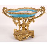 A 19th Century Sevrès gilt mounted centrepiece, the bowl of shaped oval form, painted with a central