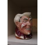 A Royal Doulton jug, The Clown, 1950s, white face clown with maroon ruff, 16cm H.
