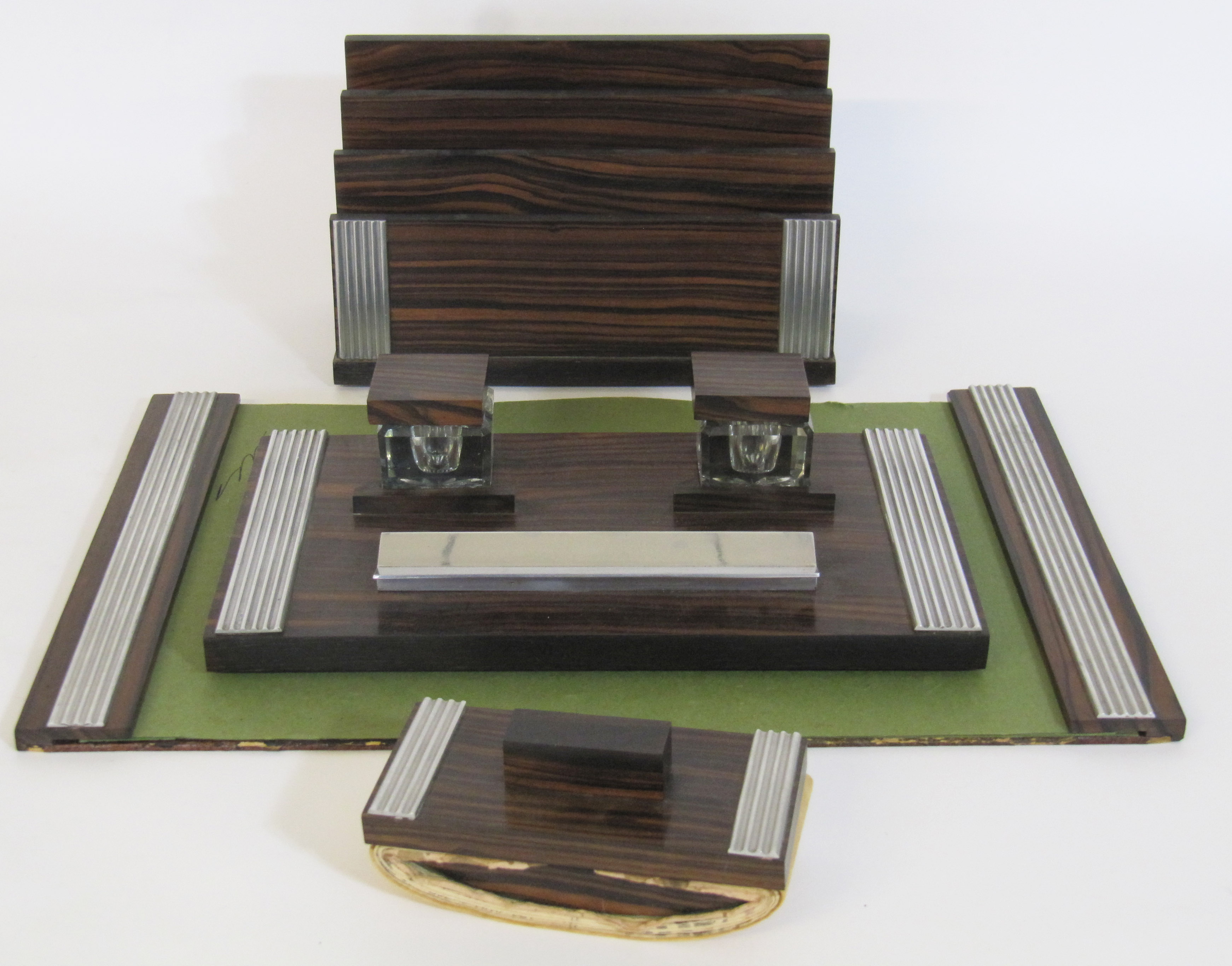 An Art Deco style desk set, mid 20th Century, consisting of a writing blotter pad, pen and ink