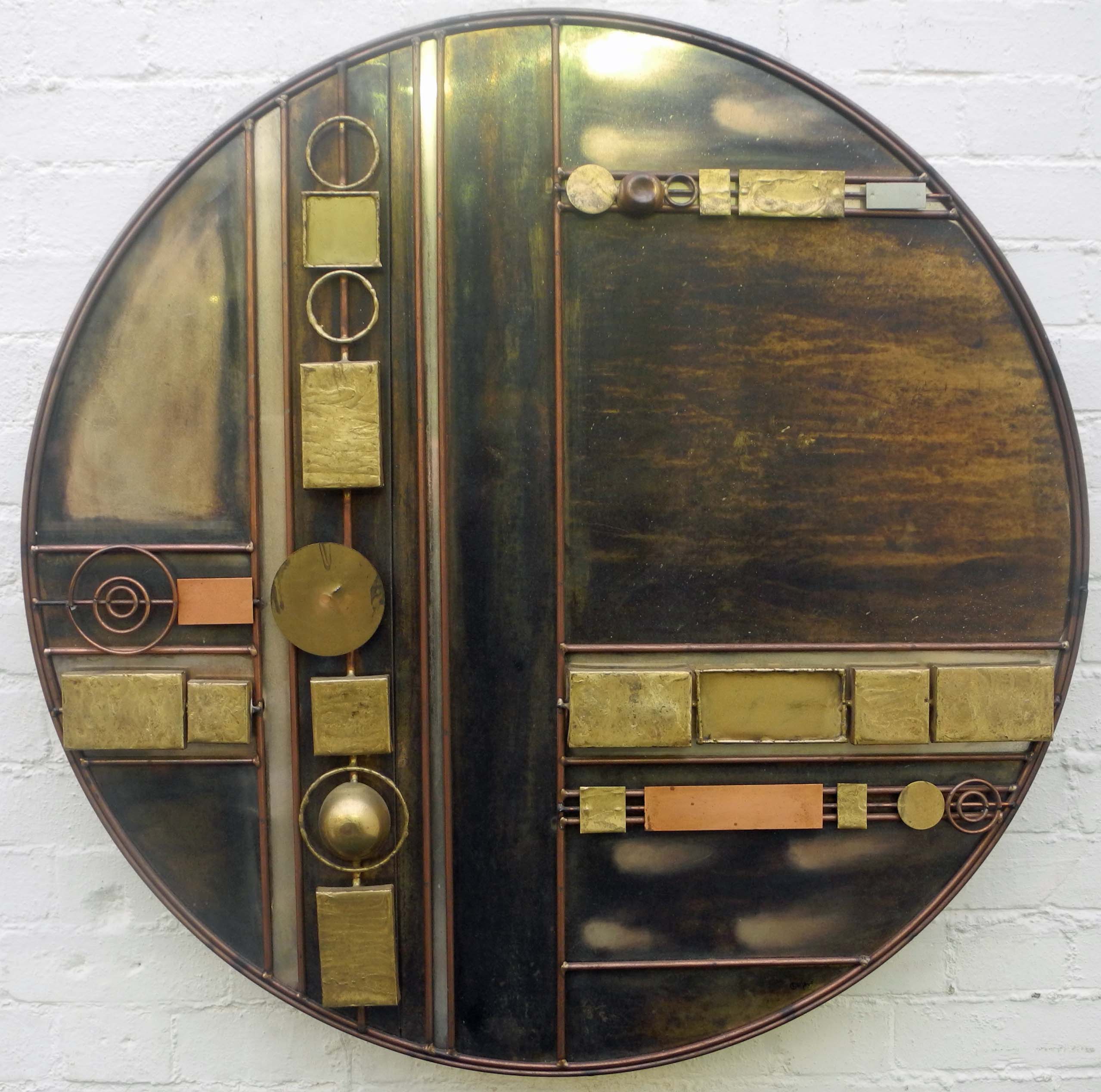 A Curtis Jere metal wall sculpture, circa 1970, disc form comprising geometric welded copper,