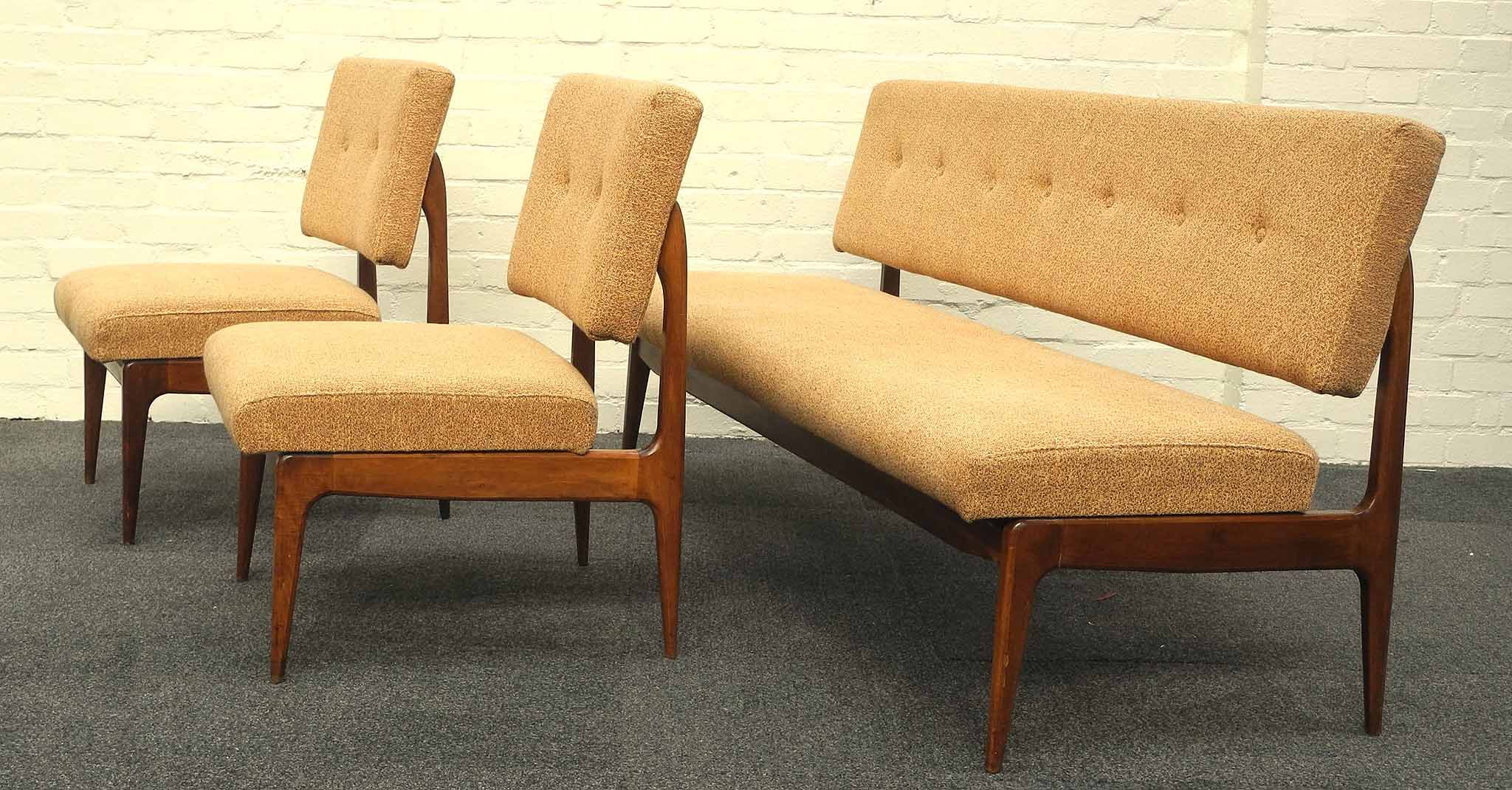 An Italian Anonomia Castelli sofa and two chairs, circa 1950, with bench style seat and back rest on