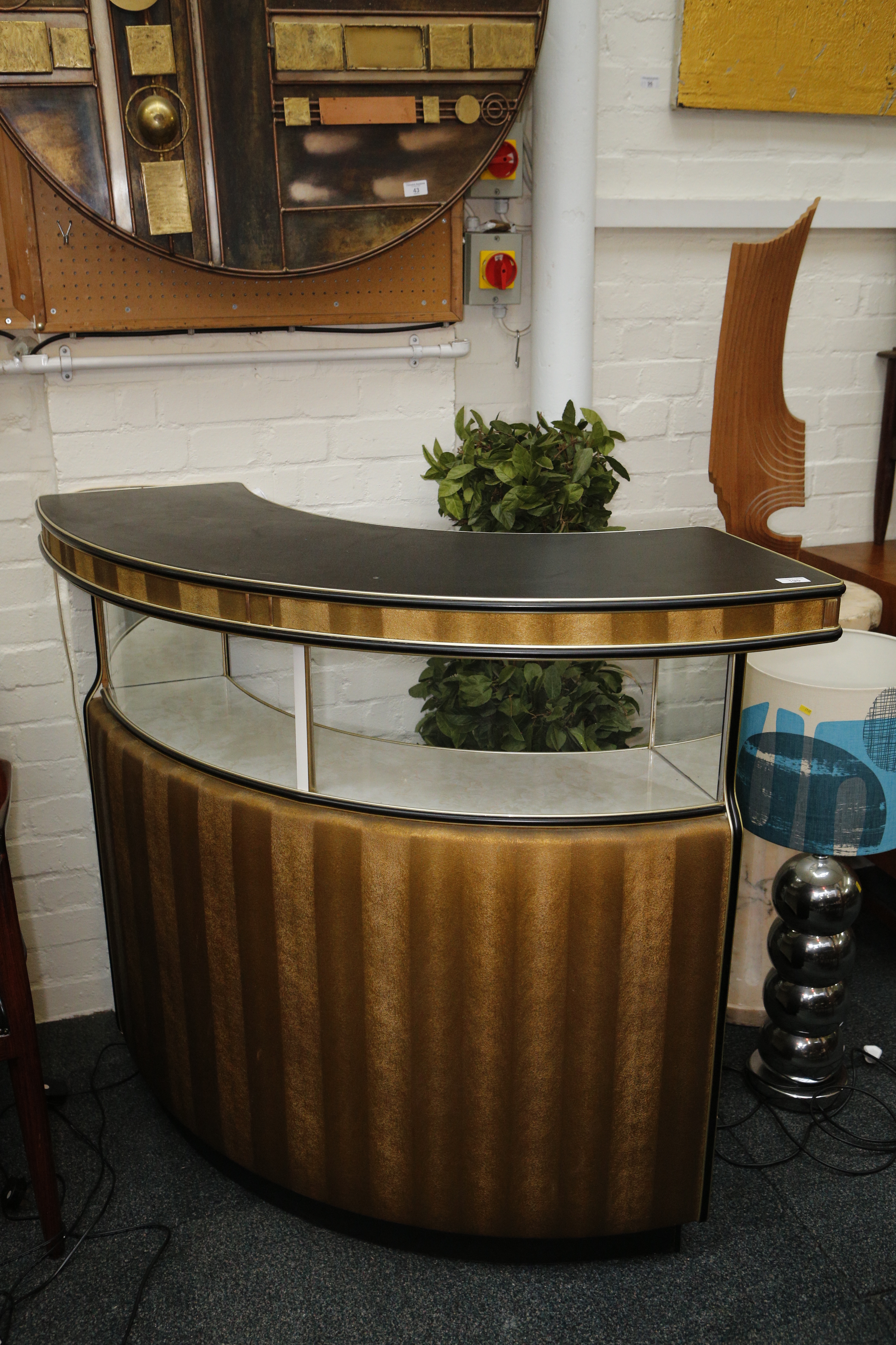 A 1960`s drinks bar, curved corner bar with glazed display area.